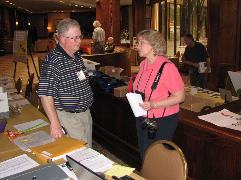 Jim Landers shares convention ideas with Debbie Hughes.
